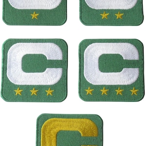 May include: Five embroidered patches with a green background and a white or yellow letter C. The patches have four gold stars at the bottom.