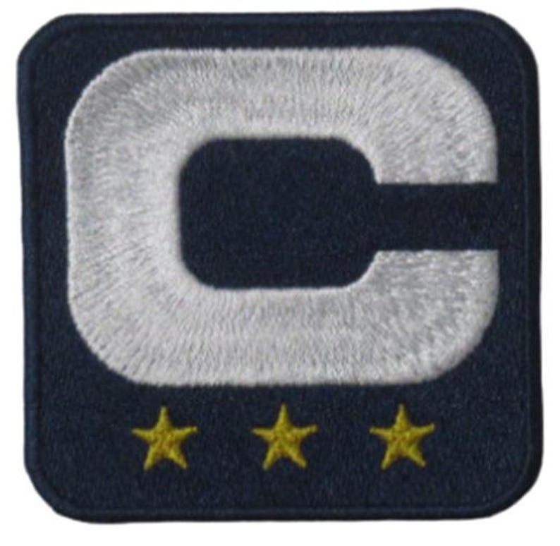 May include: Embroidered patch featuring a large white letter "C" on a navy blue background. Below the letter are three gold stars. The patch has a square shape with rounded corners.