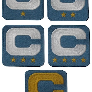 May include: Five embroidered patches featuring a capital letter "C" in white or gold, set against a blue background. Each patch has a different number of gold stars below the letter, ranging from one to five stars. The patches are square.