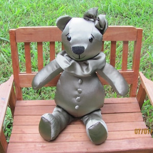 Memory bear approximately 14 inches tall from head to toe, 10 inches in the sitting position.