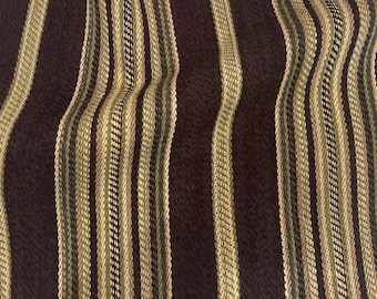 May include: A rectangular piece of fabric featuring a vertical striped pattern in dark brown, olive green, and cream. The textile has a textured weave and frayed edges along the sides. The text DesignNash.Etsy is visible in the bottom corner.