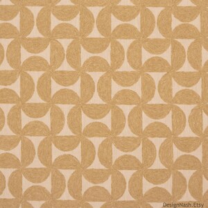 May include: A fabric featuring a repeating geometric pattern of tan semicircles arranged in interlocking circular shapes against a light beige background. The design creates a continuous, symmetrical grid of curved lines across the textile surface.