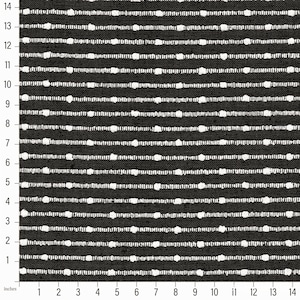 May include: Black and white fabric with a repeating pattern of small white circles in horizontal rows. The fabric is measured in inches.
