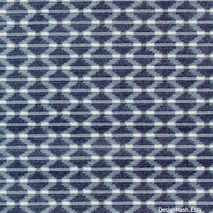 May include: A blue and white geometric patterned fabric with a subtle texture. The pattern is made up of small diamonds and lines.
