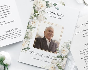May include: White floral funeral program with a gold frame surrounding a photo of a man. The program includes the text "Honoring the Life of" and "Michael Anderson" with dates. The program also includes the text "Order of Service" and "God's Garden".