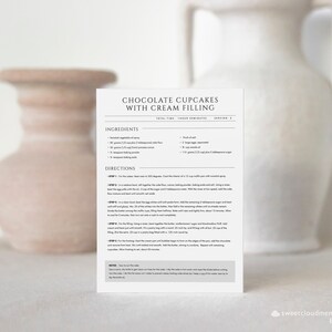 May include: A printable recipe card for chocolate cupcakes with cream filling. The recipe includes ingredients and directions for making the cupcakes and the filling. The card is printed on white paper with black text.