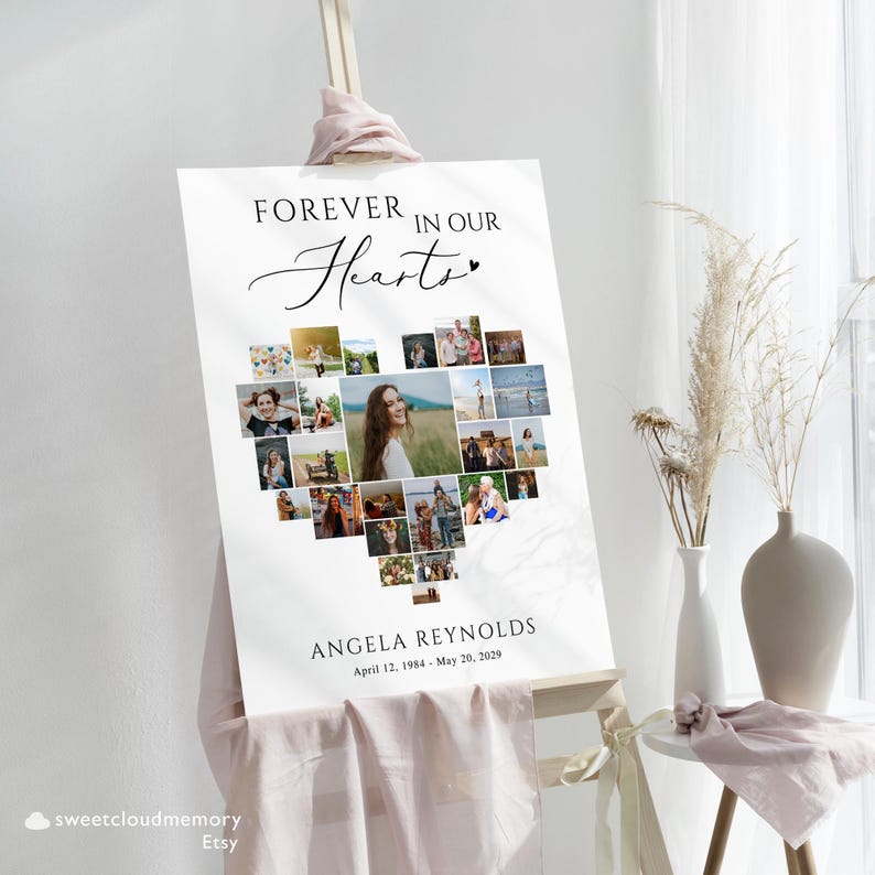 May include: A white poster with a heart-shaped photo collage of a woman. The text "Forever in our Hearts" is at the top of the poster. The woman's name, "Angela Reynolds", and dates "April 12, 1984 - May 20, 2029" are at the bottom of the poster.