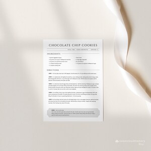 May include: A printable recipe card for chocolate chip cookies. The recipe includes ingredients like butter, sugar, eggs, flour, and chocolate chips. The directions are listed in steps with instructions for mixing, baking, and cooling the cookies.