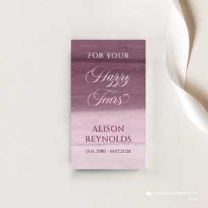 May include: A purple and pink watercolour background with the text "For Your Happy Tears" in white cursive font. Below the text is the name "Alison Reynolds" and the dates "Jan. 1980 - May 2028".