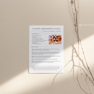 May include: Printable recipe card for classic Margherita pizza with a photo of a finished pizza. The recipe includes ingredients and directions for making the pizza.