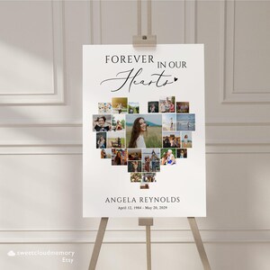 May include: A white poster with a heart-shaped photo collage of a person. The text "FOREVER IN OUR HEARTS" is at the top of the poster. The text "ANGELA REYNOLDS April 12, 1984 - May 20, 2029" is at the bottom of the poster.