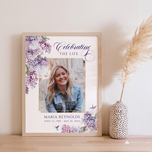 May include: A printable memorial template with a watercolor floral design in shades of purple and pink. The template features a photo placeholder, the text "Celebrating the Life", and the name "Maria Reynolds" with dates.