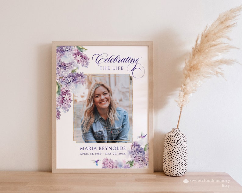 May include: A printable memorial template with a watercolor floral design in shades of purple and pink. The template features a photo placeholder, the text "Celebrating the Life", and the name "Maria Reynolds" with dates.