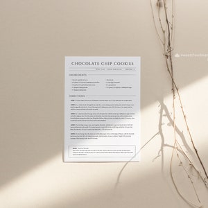 May include: Printable recipe card for chocolate chip cookies with a white background and black text. The recipe includes ingredients and directions for making the cookies. The card has the title "Chocolate Chip Cookies" and the text "sweetcloudmemory Etsy".