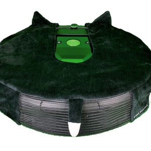 May include: A green robotic lawnmower with a black protective cover. The cover has a mesh bottom and a plush top with a cat-like design.