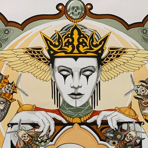 May include: A woman with a crown and wings, wearing a black and white face paint, holds a large, ornate, gold-colored frame. The frame is decorated with skulls and moths. The background is a light yellow and green.