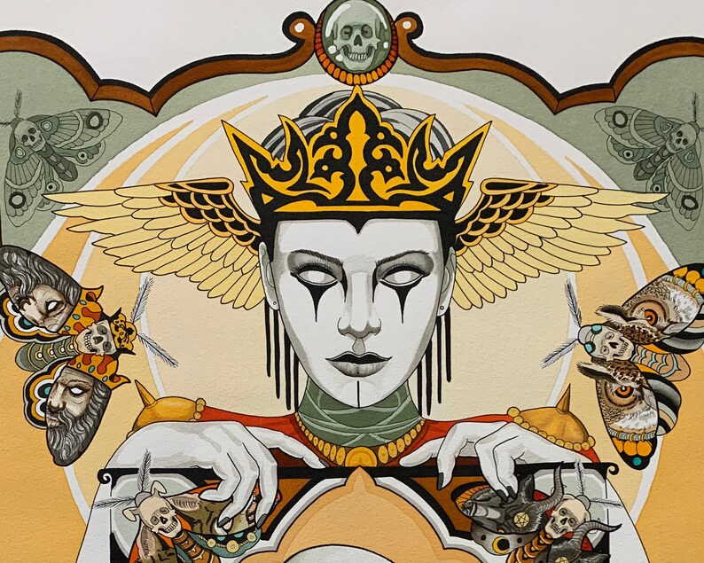May include: A woman with a crown and wings, wearing a black and white face paint, holds a large, ornate, gold-colored frame. The frame is decorated with skulls and moths. The background is a light yellow and green.
