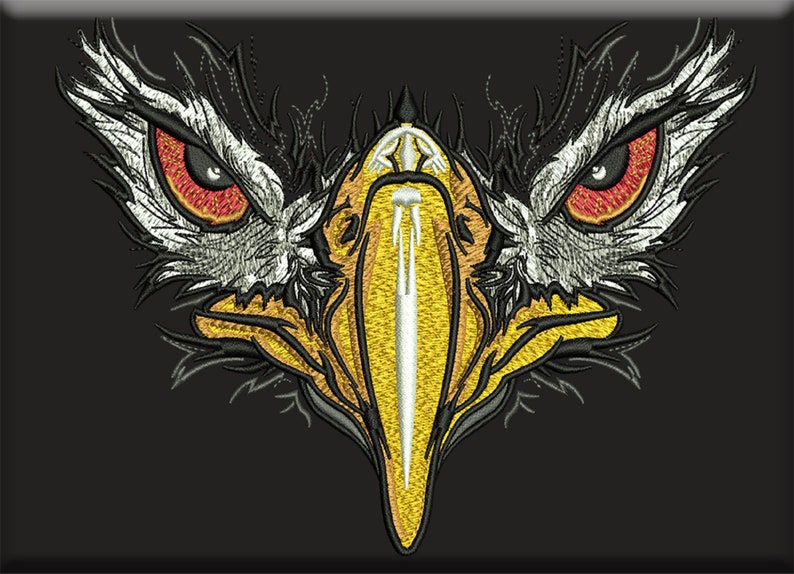 May include: An embroidered patch featuring a stylized eagle head design. The eagle has piercing red eyes, white and black feathered details, and a prominent yellow beak with a central white vertical stripe, all set against a solid black background.