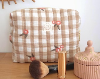 Toiletry bag, makeup bag, pouch.