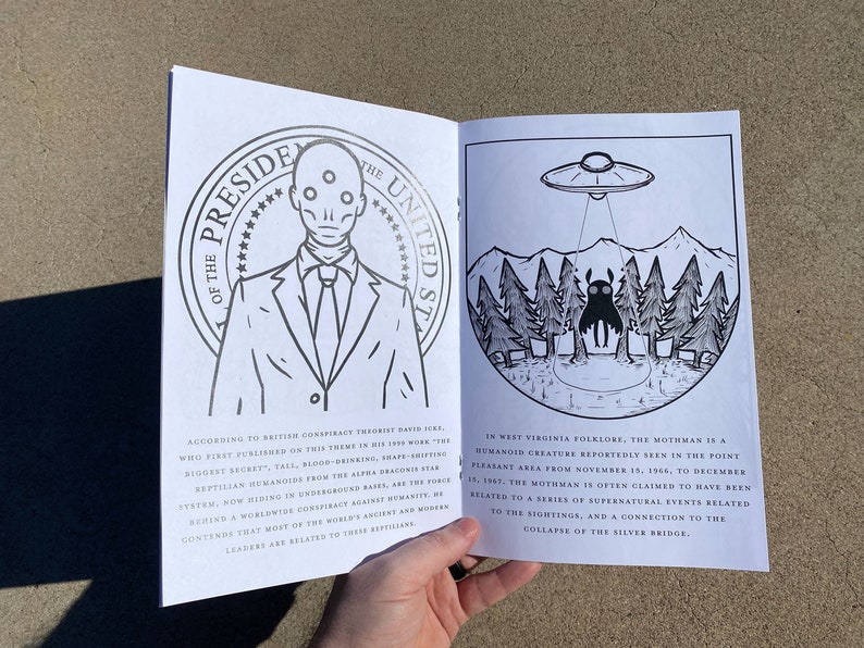 May include: An open book with black and white illustrations. The left page features a man in a suit with three eyes and the text "President of the United States". The right page features a black creature with large eyes and a flying saucer above it. The text reads "In West Virginia folklore, the Mothman is a humanoid creature reportedly seen in the Point Pleasant area from November 15, 1966, to December 15, 1967. The Mothman is often claimed to have been related to a series of supernatural events related to the sightings, and a connection to the collapse of the Silver Bridge."