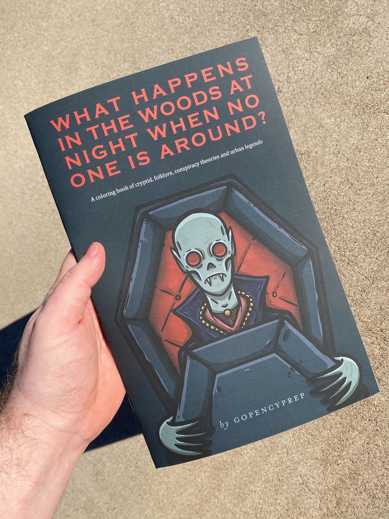 May include: A coloring book titled "What Happens in the Woods at Night When No One is Around?" with a dark blue cover featuring an illustration of a vampire sitting in a coffin. The book is a coloring book of cryptid, folklore, conspiracy theories and urban legends by GOPENCYPREP.