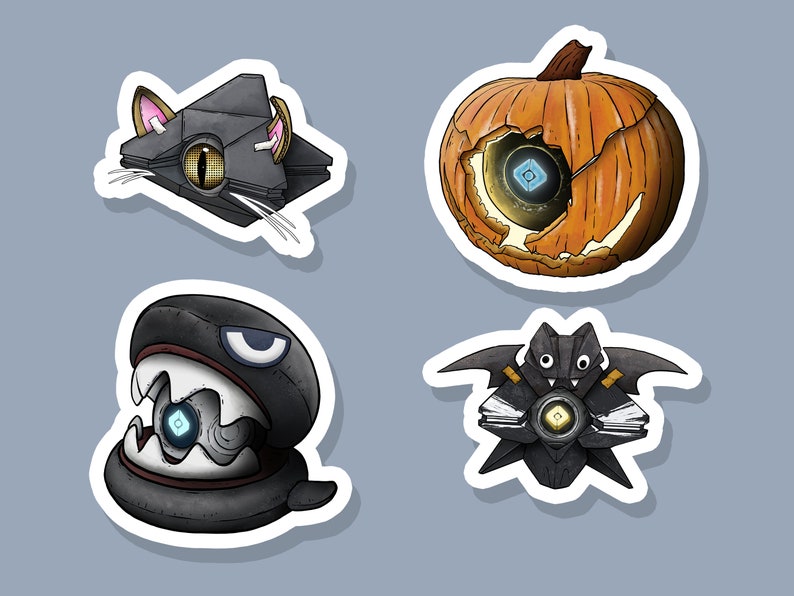 May include: Four Halloween-themed stickers featuring a black cat, a pumpkin, a bat, and a creature with a large mouth. Each sticker has a glowing blue light inside.