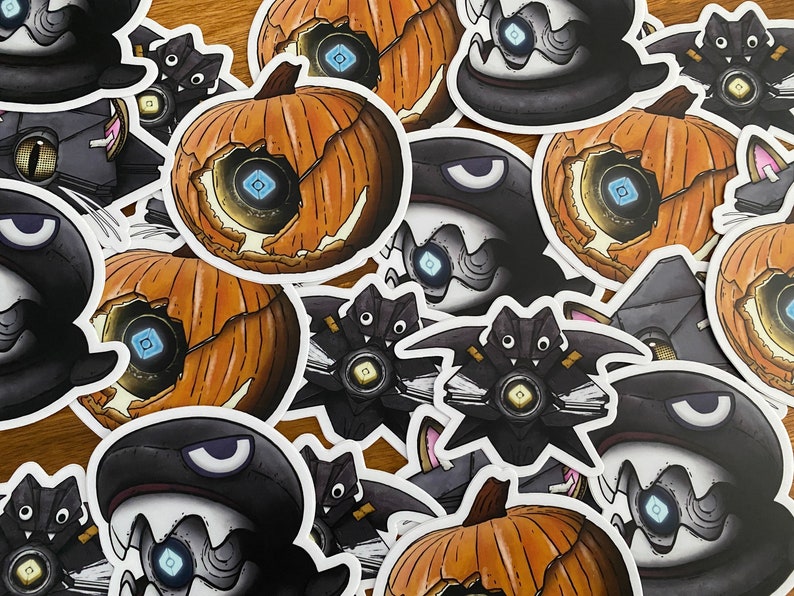 May include: A collection of Halloween-themed stickers featuring a variety of characters and designs. The stickers are printed on white paper and have a glossy finish. The characters include a pumpkin, a bat, and a ghost. The designs are all related to the theme of Halloween.