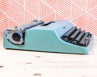 1960's Red Remington Starfire Portable Typewriter With 1960's Red Remington Starfire Portable Typewriter With