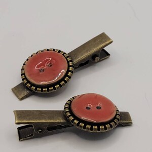 bronze colored hair clips with button detail