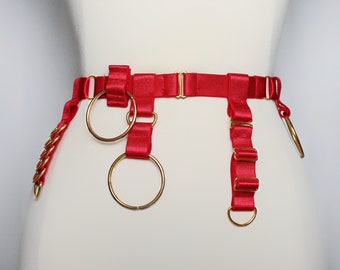 Satin waist belt with gold O rings and other sliders