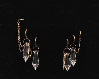 Golden ear jewel with glass pendants and chains