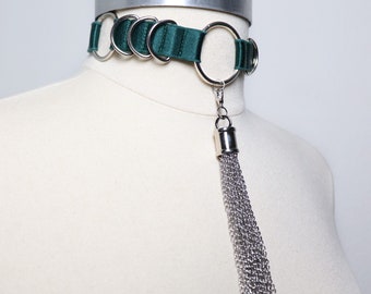 Choker with eyelets and piercings decorated with a bow