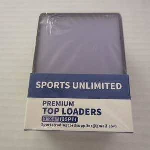 May include: A package of clear plastic top loaders for trading cards. The package is blue and white and says "Sports Unlimited Premium Top Loaders 3" x 4" (35PT) Sportstradingcardsupplies@gmail.com"