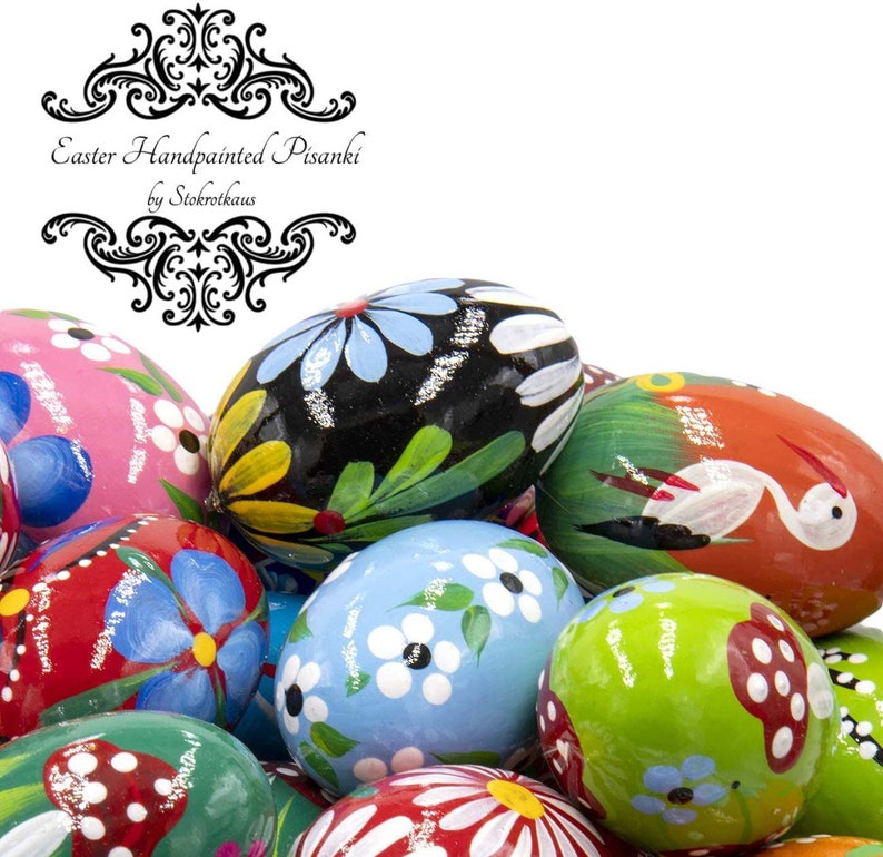 Colorful wooden Easter eggs. The eggs are made out of wood and hand painted. Floral eggs and eggs with stork, mushroom.