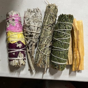 May include: Five bundles of smudge sticks, including white sage, cedar, palo santo, and a colorful floral smudge stick.