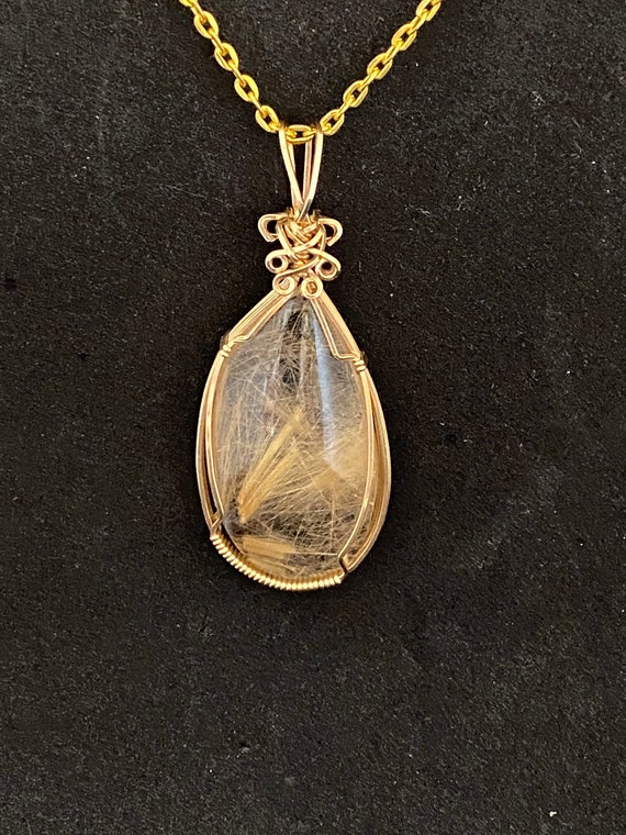 Golden rutilated quartz pendant deals