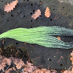 double-sided dreadlocks from black to lime or one-sided