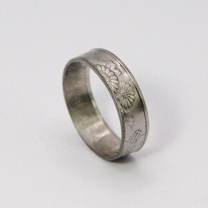 This is our polished version is our 50 yen coin ring. With a double flower displayed!