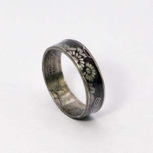 This is the antiqued version of our 50 yen coin ring. With a double flower displayed!
