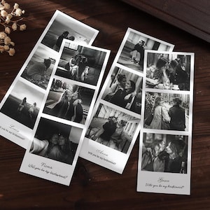 May include: Three vertical photo strips featuring black and white images of people. Each strip includes a name and the text "Will you be my bridesmaid?" at the bottom. The strips are arranged on a dark wooden surface with small white flowers.