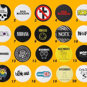 May include: A collection of 20 round pinback buttons with various band logos and designs. The buttons feature bands like Bad Religion, Nirvana, NOFX, Ramones, and Blink-182. The buttons are white, black, and yellow with text and graphics.