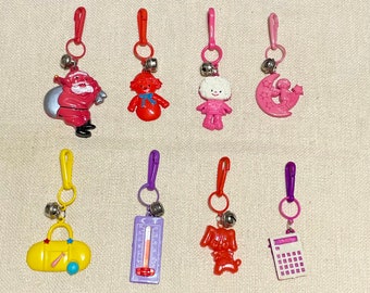 Vintage 80’s Retro Plastic Charms Santa, Snowman, Doll, Kid on The Moon, Sports Duffel Bag, Thermometer, Red Dog, Calculator Charm