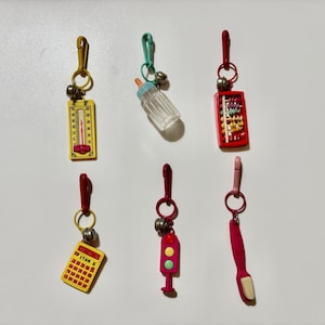 Vintage 80’s Retro Plastic Charms Thermometer, Baby Bottle, Abacus, Yellow Calculator, Pink Traffic Signal, Pink Toothbrush