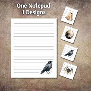 May include: A lined notepad with the text "One Notepad 4 Designs." The notepad features a watercolor illustration of a crow with a key, and four smaller designs: a ghost, a planet, a crow, and a bat.