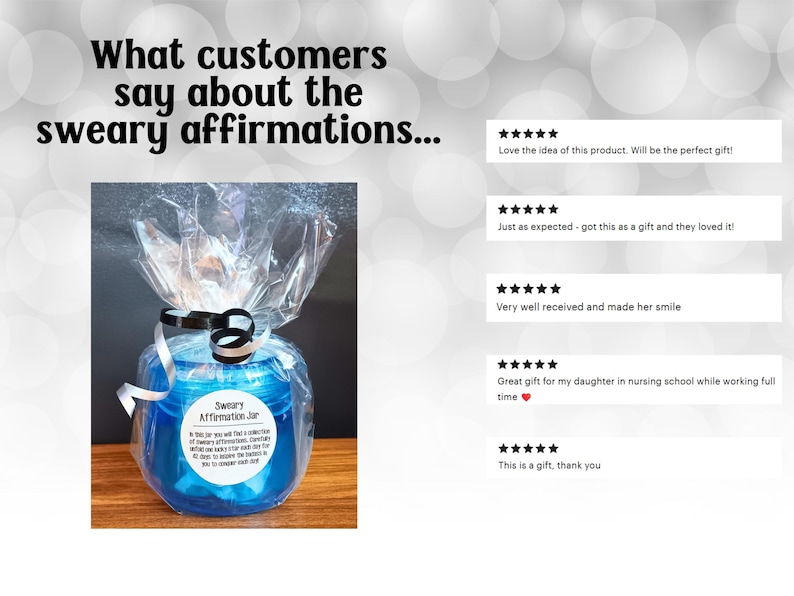 May include: A blue plastic jar wrapped in clear cellophane with a black and white ribbon. The label reads Sweary Affirmation Jar and includes text about daily affirmations. Five star reviews are displayed to the right of the jar.