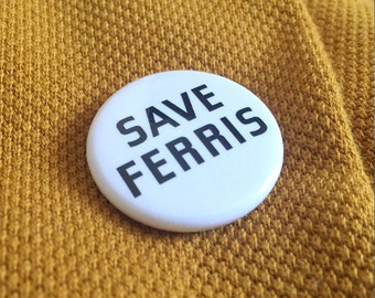 Puede incluir: Botón blanco con texto negro que dice "Save Ferris".