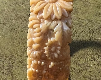 A carved Bakelite bangle
