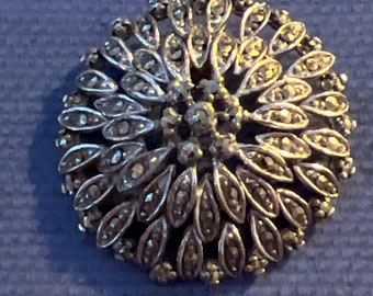 Metal and markesite brooch