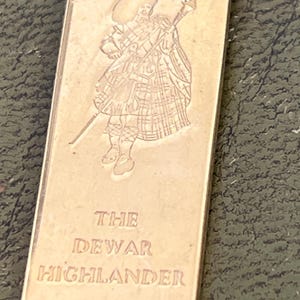gold metal Scottish highlander pendant