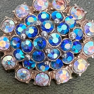 stunning metal and glass brooch